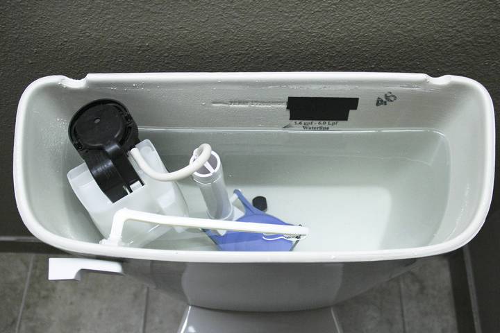 A high water level in the tank may indicate there is a leak under toilet.